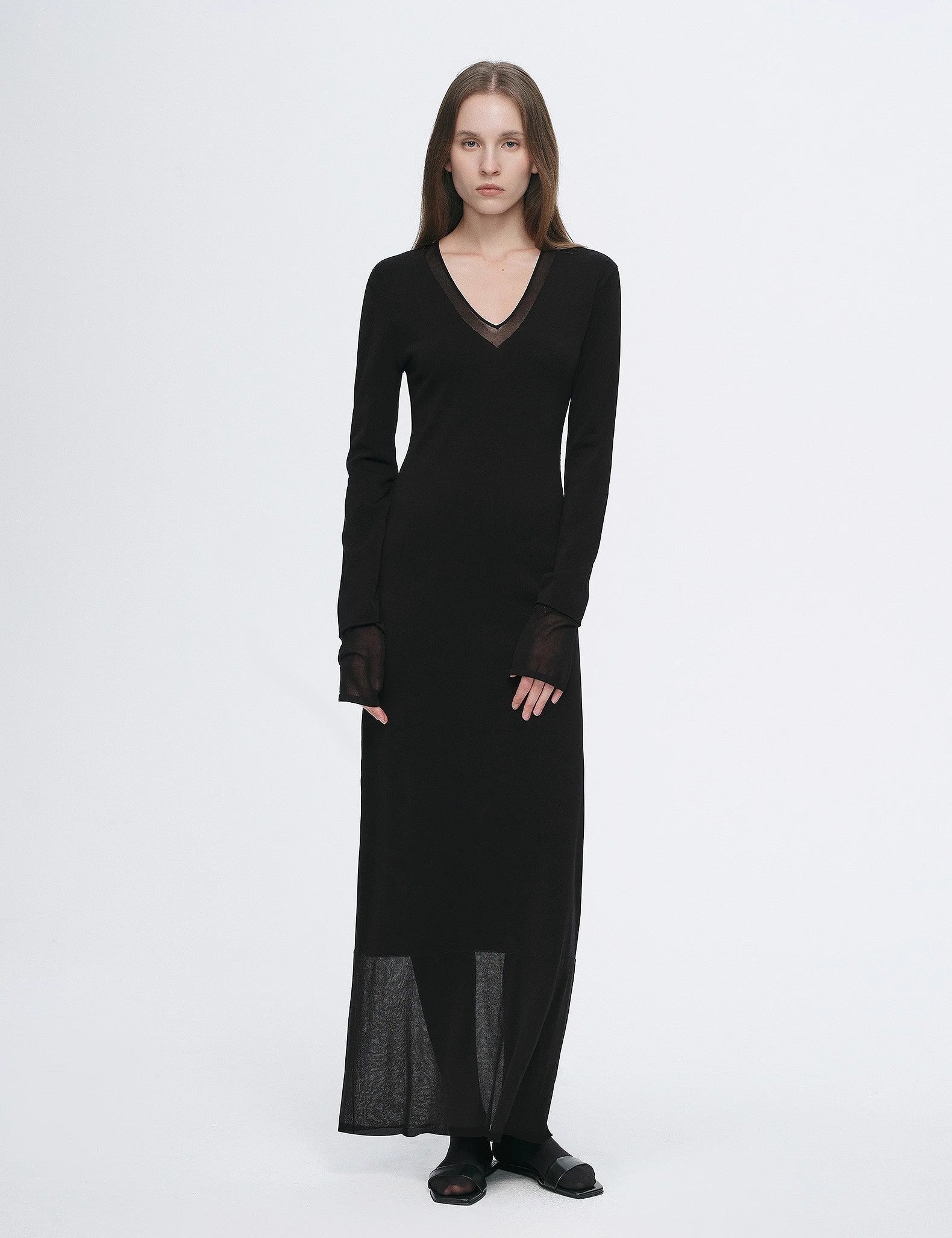 Alt Tag: Virella Mesh-Splice V-Neck Dress in black, featuring a minimalist design with sheer panels, creating a modern, elegant silhouette.