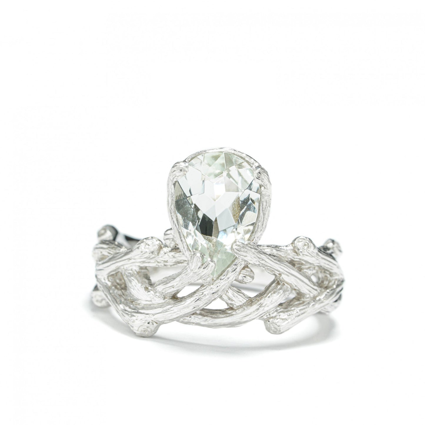 "Verdant Grace ring with green amethyst centerpiece, handcrafted in sterling silver and white rhodium, exuding elegance and style"