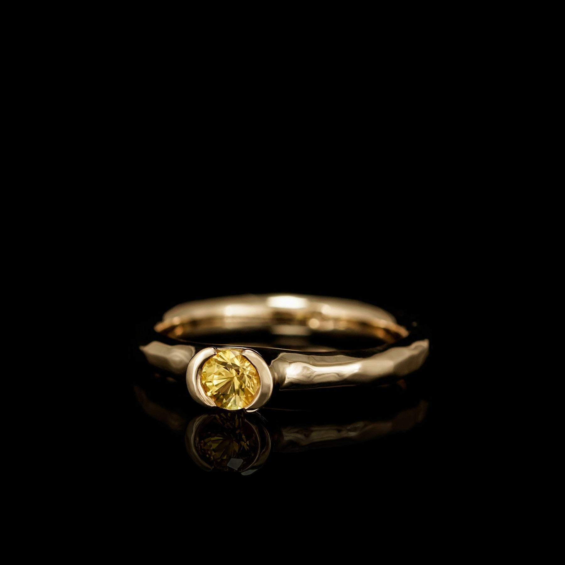 Elegant Golden Eternity engagement ring with yellow sapphire in 18K yellow gold, symbolizing love and commitment.