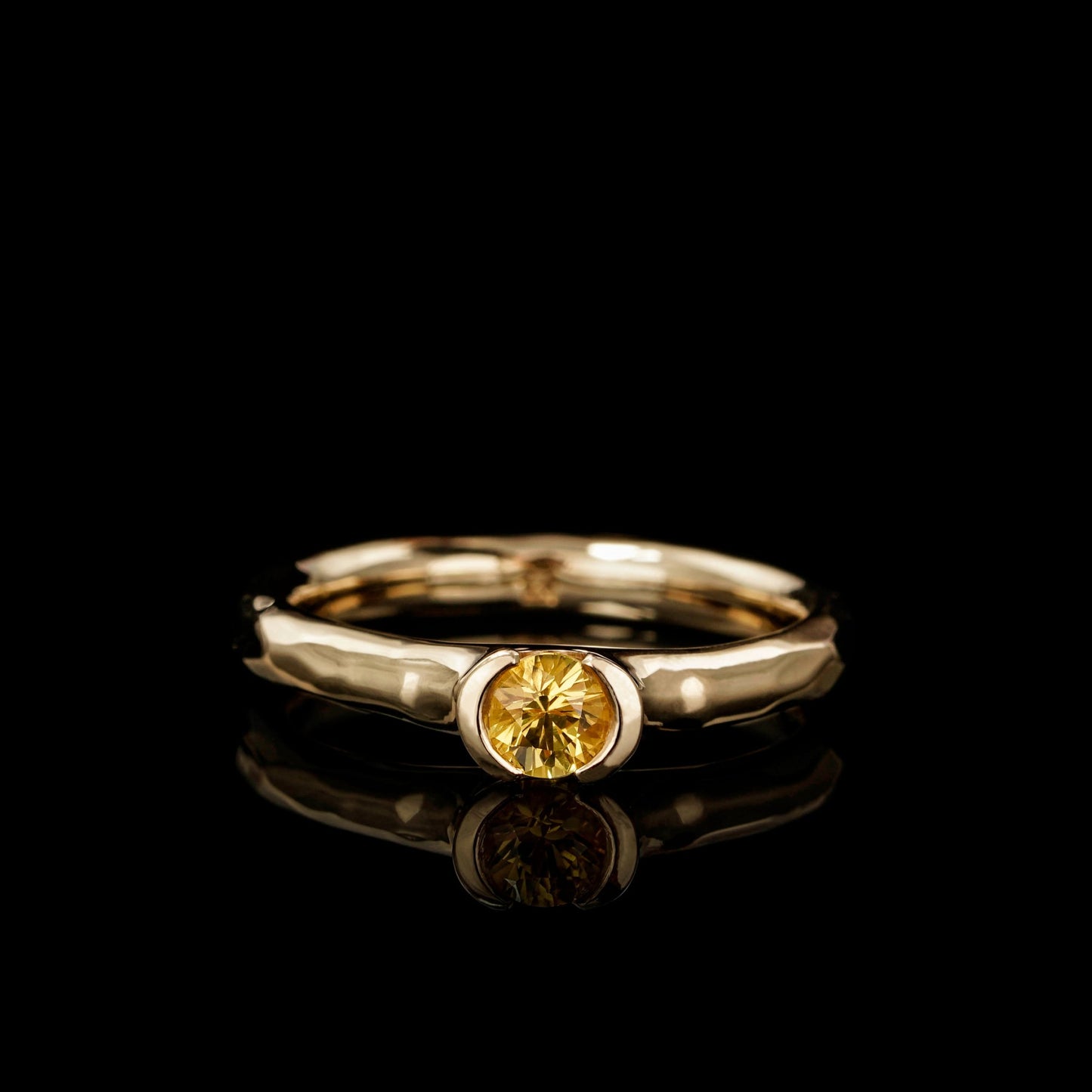 Elegant "Golden Eternity" engagement ring with a yellow sapphire in 18K yellow gold, symbolizing love and commitment.