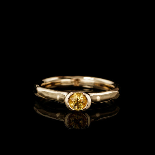 Elegant "Golden Eternity" engagement ring with a yellow sapphire in 18K yellow gold, symbolizing love and commitment.