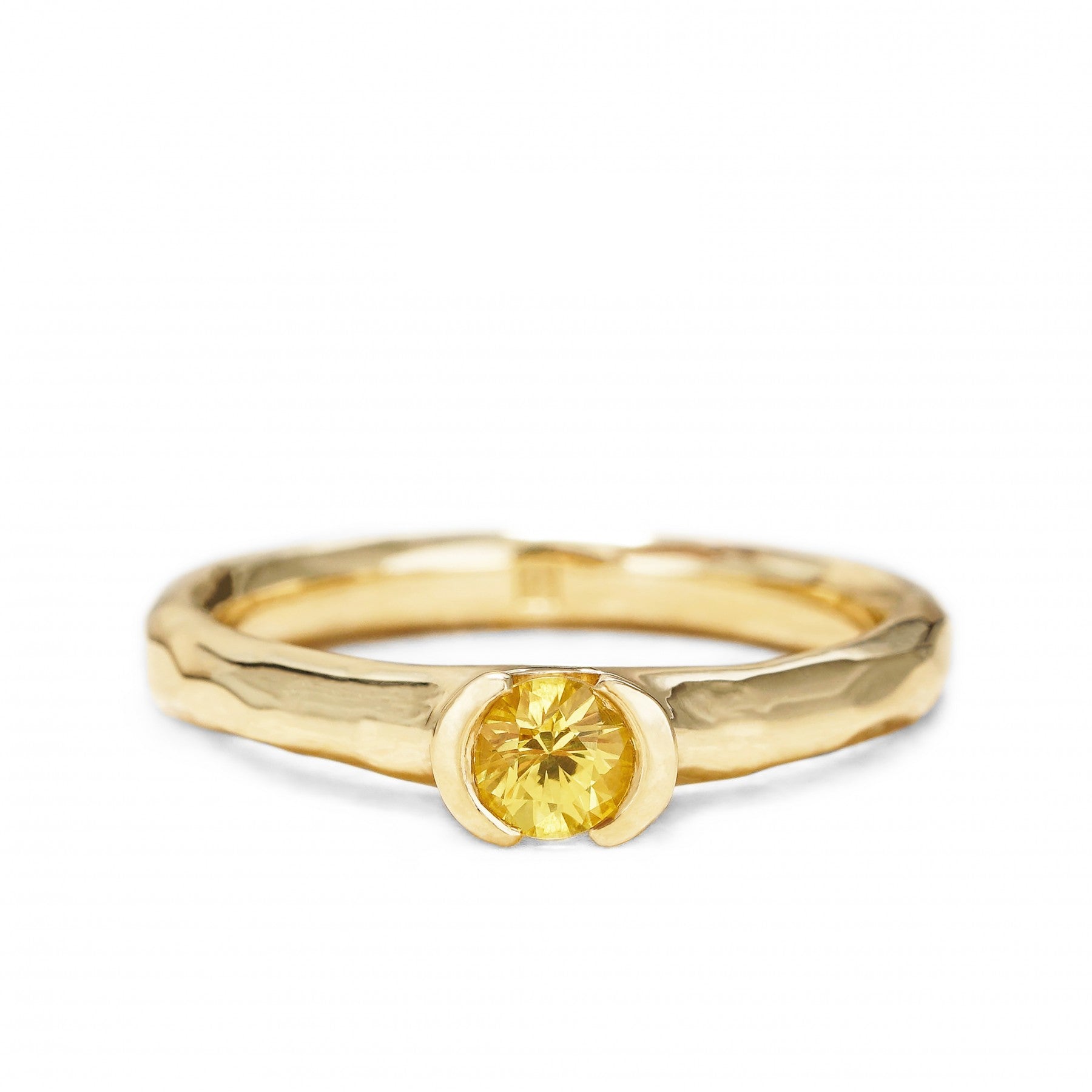 Engagement ring with yellow sapphire in 18K yellow gold, "Golden Eternity", symbolizing love and commitment.