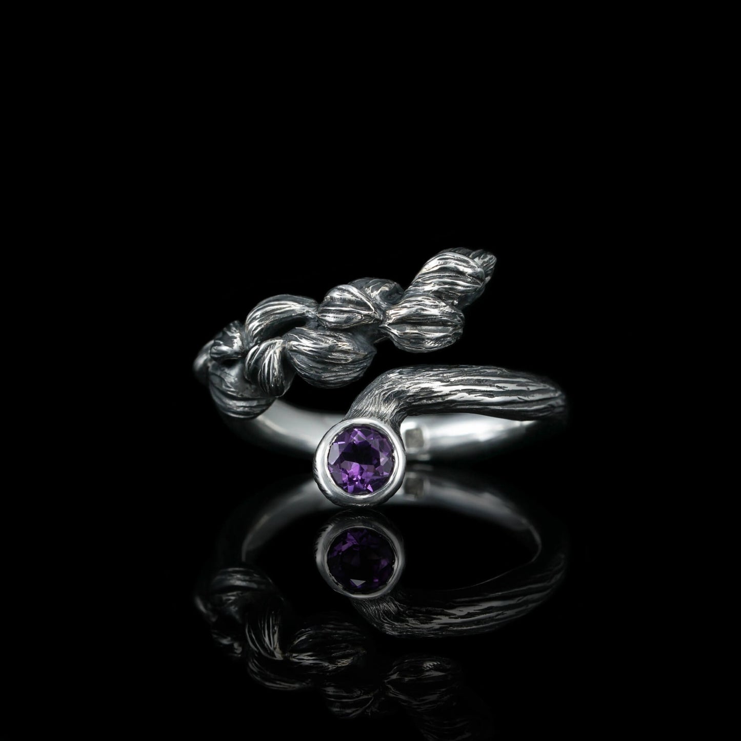 Sterling silver "Blossom Symphony" ring with amethyst gemstone, handcrafted from quality silver and rhodium-plated for elegance and durability.