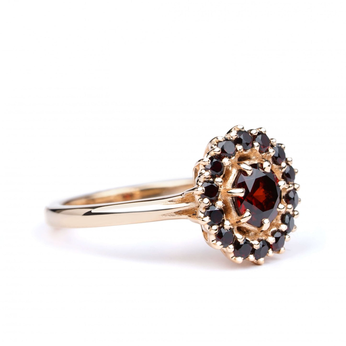 Fiery Allure Ring in red 14K gold with centerpiece garnet and 13 accent stones, showcasing elegance and timeless beauty.