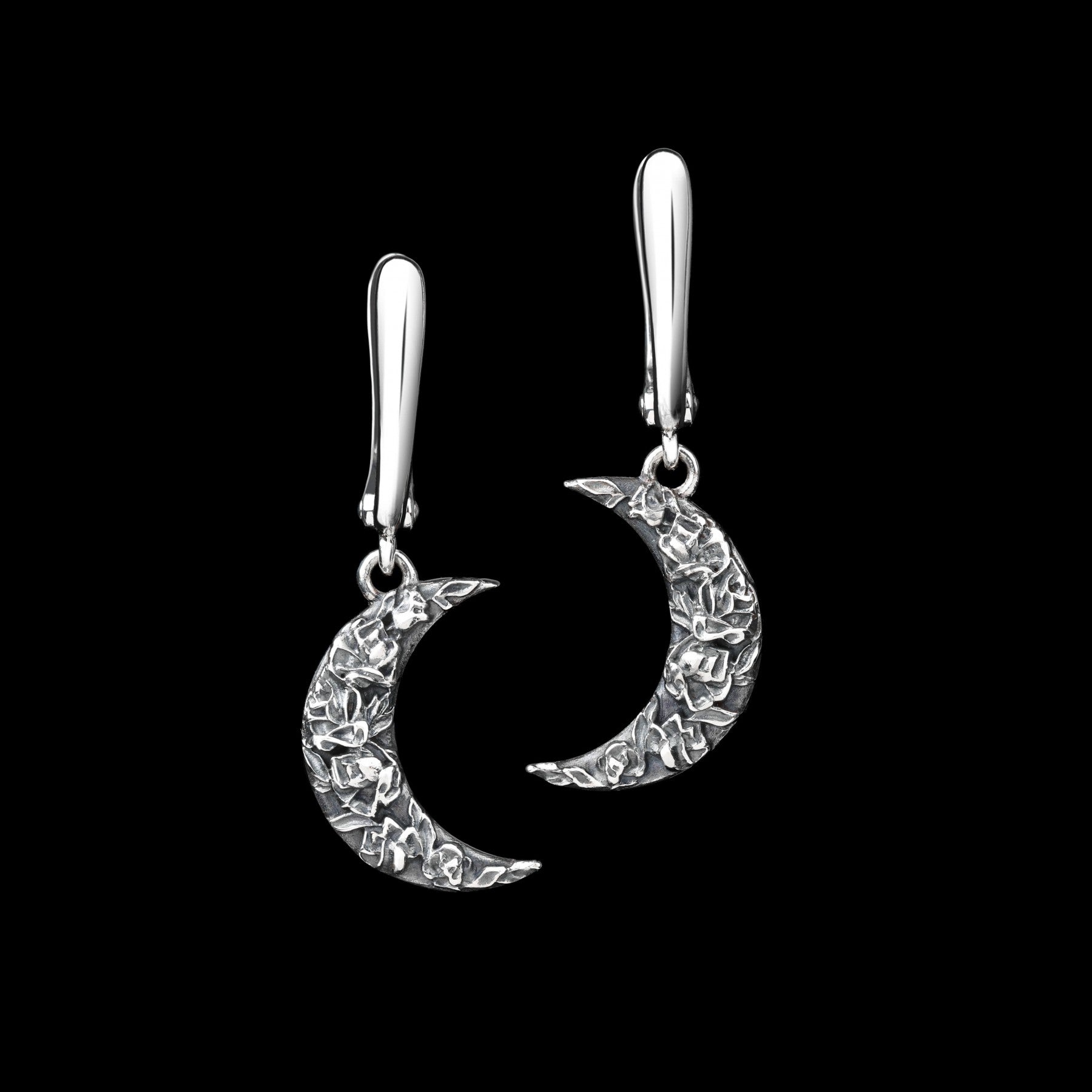 Sterling silver earrings with crescent moon and rose design, oxidized patina finish, "Midnight Rose" collection.