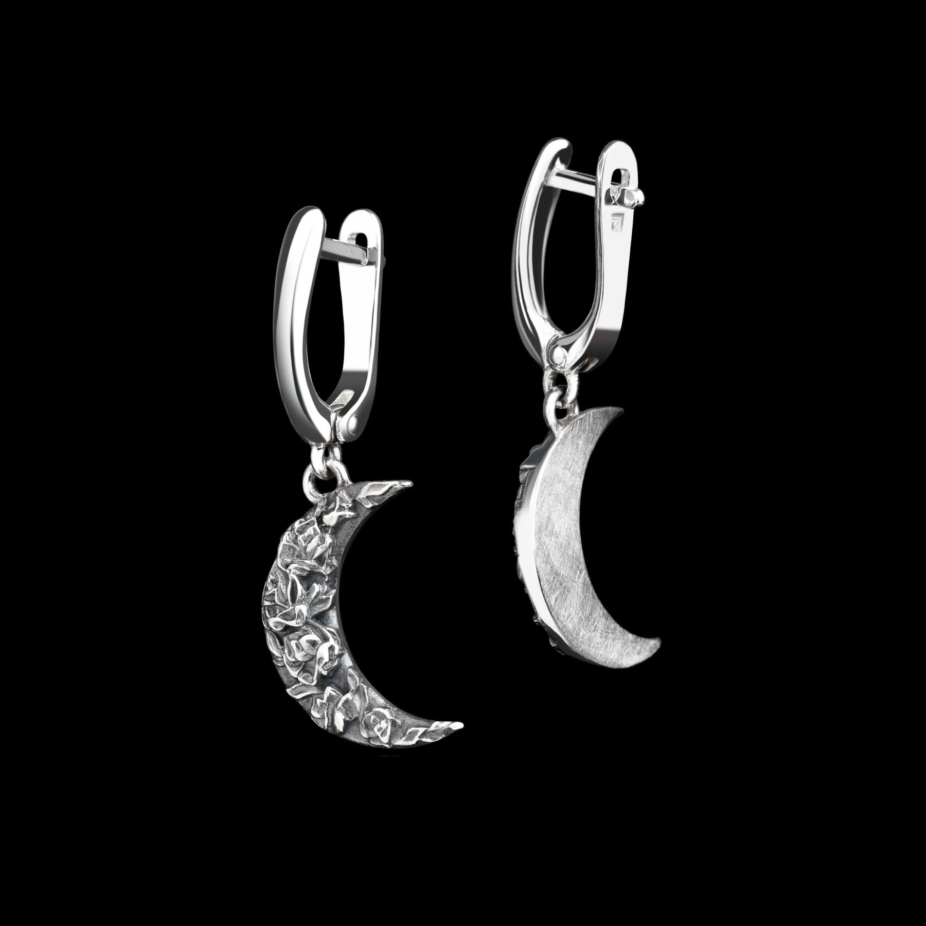 Sterling silver crescent moon earrings with intricate rose design, showcasing elegance and artistry in the "Midnight Rose" collection.