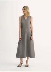 Model wearing Aurevae Cupro-Linen A-Line Dress with V-neck and sleeveless bodice, showcasing breathable, soft fabric with subtle sheen.