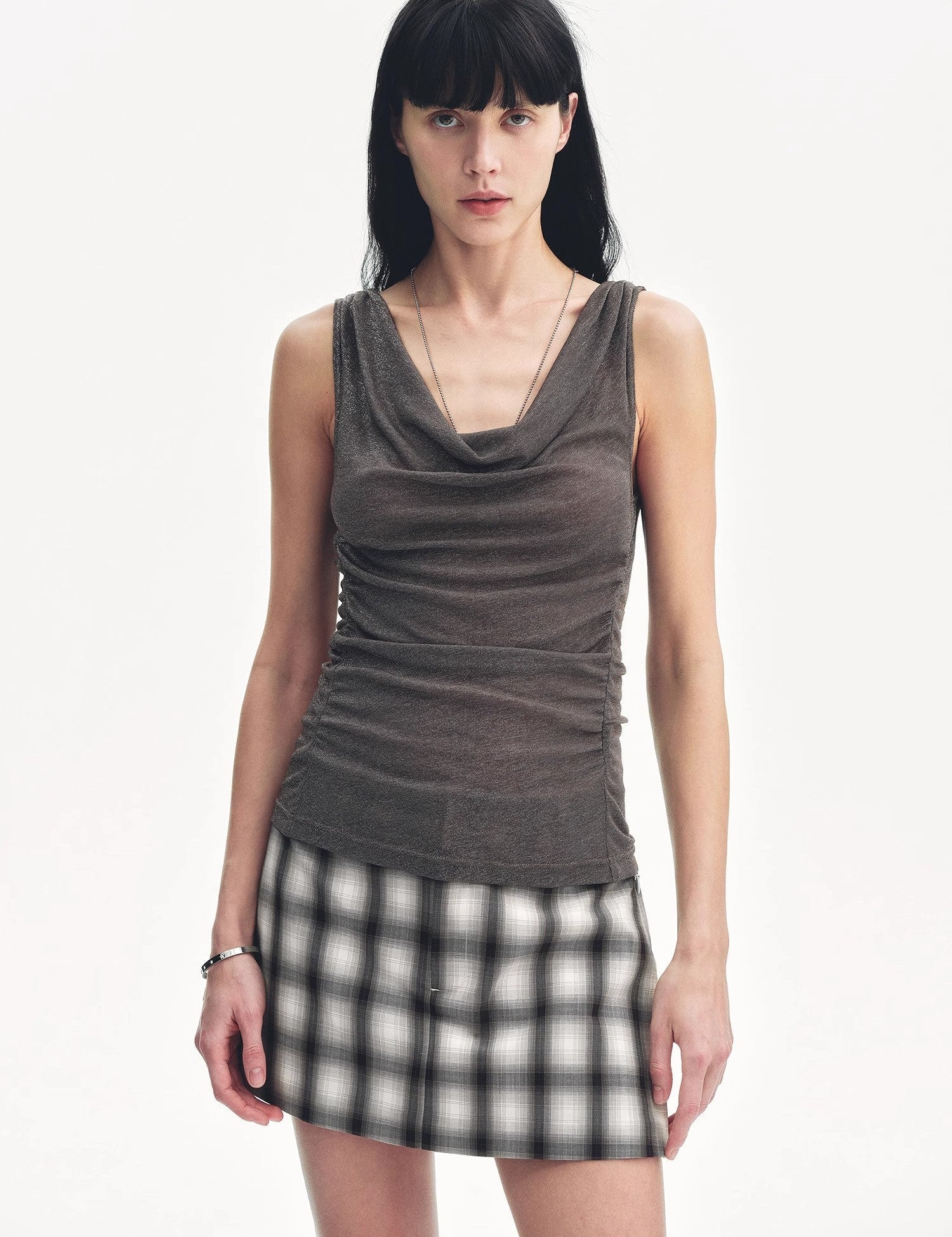 Woman wearing Zirellin Drape Contour Vest with draped neckline and adjustable drawstrings, showing elegant style and perfect fit.