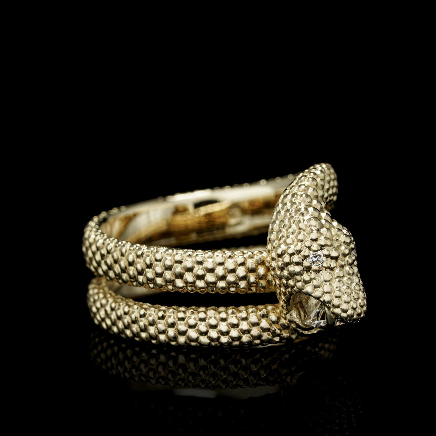 Yellow gold snake motif ring with diamonds, featuring "Serpent Symphony" design in 14K gold, symbolizing wisdom and transformation.