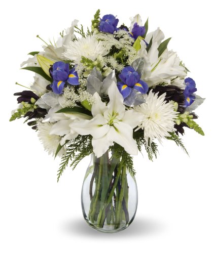 Elegant Hanukkah bouquet with irises, lilies, mums, snapdragons, silver salal in a vase, perfect for holiday celebrations.