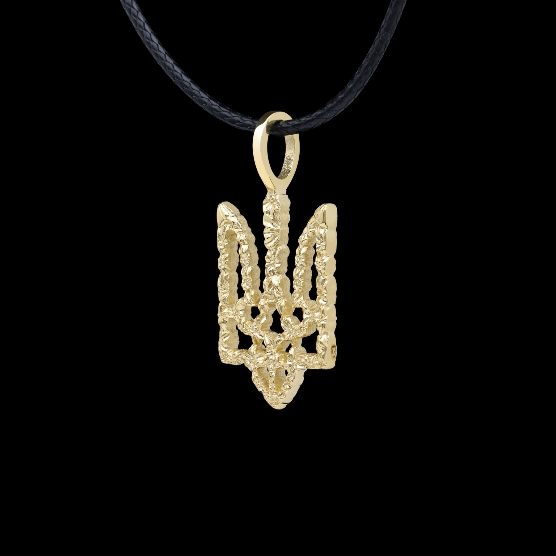 Handcrafted 14K Yellow Gold Ukrainian Trizub Pendant on black cord, showcasing intricate design and cultural heritage.