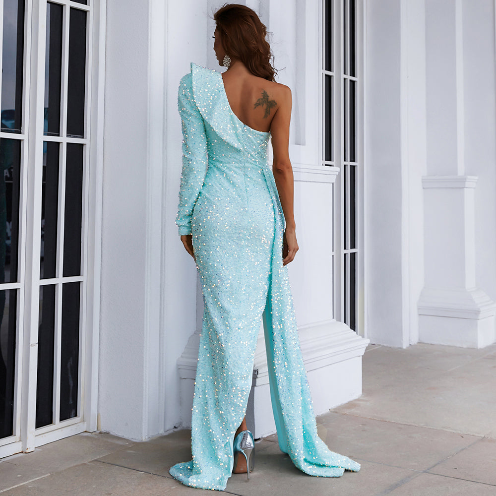 Back view of woman wearing a light blue one-shoulder sequin gown with asymmetrical neckline, perfect for formal events.