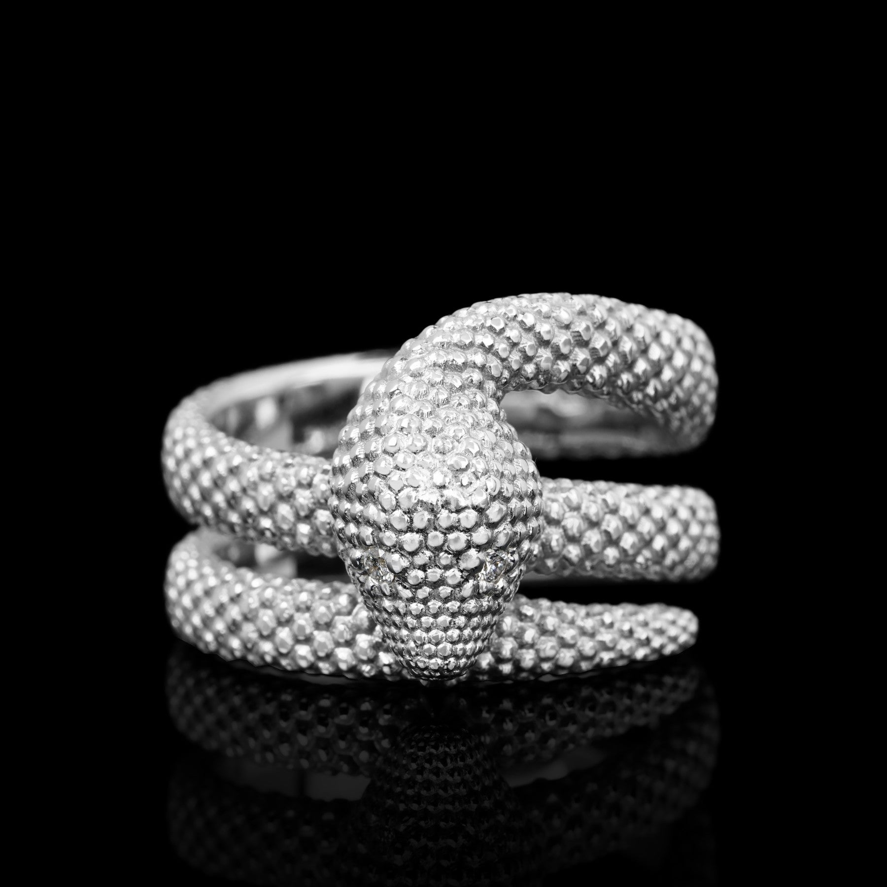 Serpent Symphony white gold ring with snake motif, 14K white gold, rhodium plated, nature-inspired minimalist design on black background.