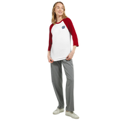 Model wearing a Mervelle Raglan Sleeve Tee with red 3/4 sleeves, showcasing the baseball-inspired style and classic fit.