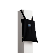 Tarselle Cotton Tote Bag displayed on stand, showcasing durable fabric and customizable print area for sustainable fashion use.