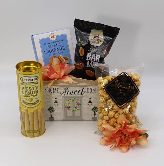 Welcome Home Sweet Treats Basket with caramel popcorn, sea salt cookies, lemon wafers, and nuts, perfect housewarming gift.