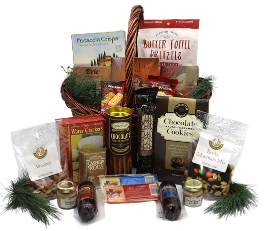 Holiday gourmet gift basket with crackers, wafers, spreads, and sweet treats for festive celebrations.