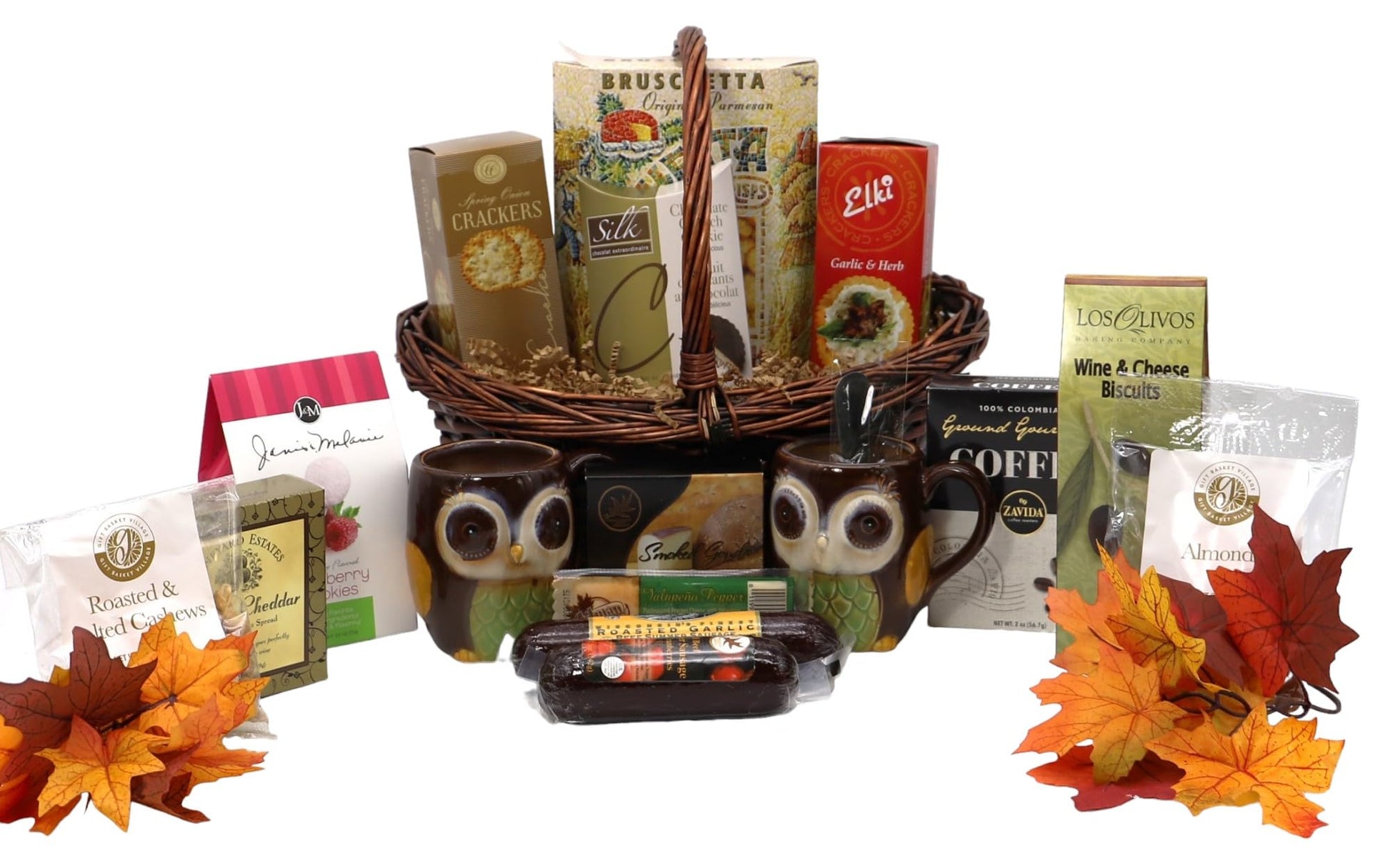 Autumn Harvest Gourmet Gift Basket with mugs, snacks, cheese, coffee, and fall leaves, perfect for cozy seasonal gatherings.