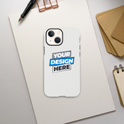 Gloss tough iPhone case with 'Your Design Here' on desktop. Durable, sleek, dual-layer protection. Wireless charging compatible.