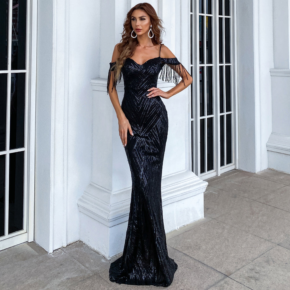 Serelina Sequin Tassel Gown off-shoulder black evening dress with sequins and tassels. Ideal for upscale events and red carpet.