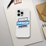 Customizable iPhone case displayed on desk with 'Your Design Here' text, showcasing sleek gloss finish and dual-layer protection.