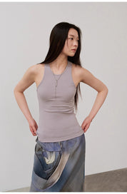 Woman wearing Isvera Slim Cotton Camisole, showcasing a stylish sleeveless fit with an I-shaped neckline for a modern, sleek look.