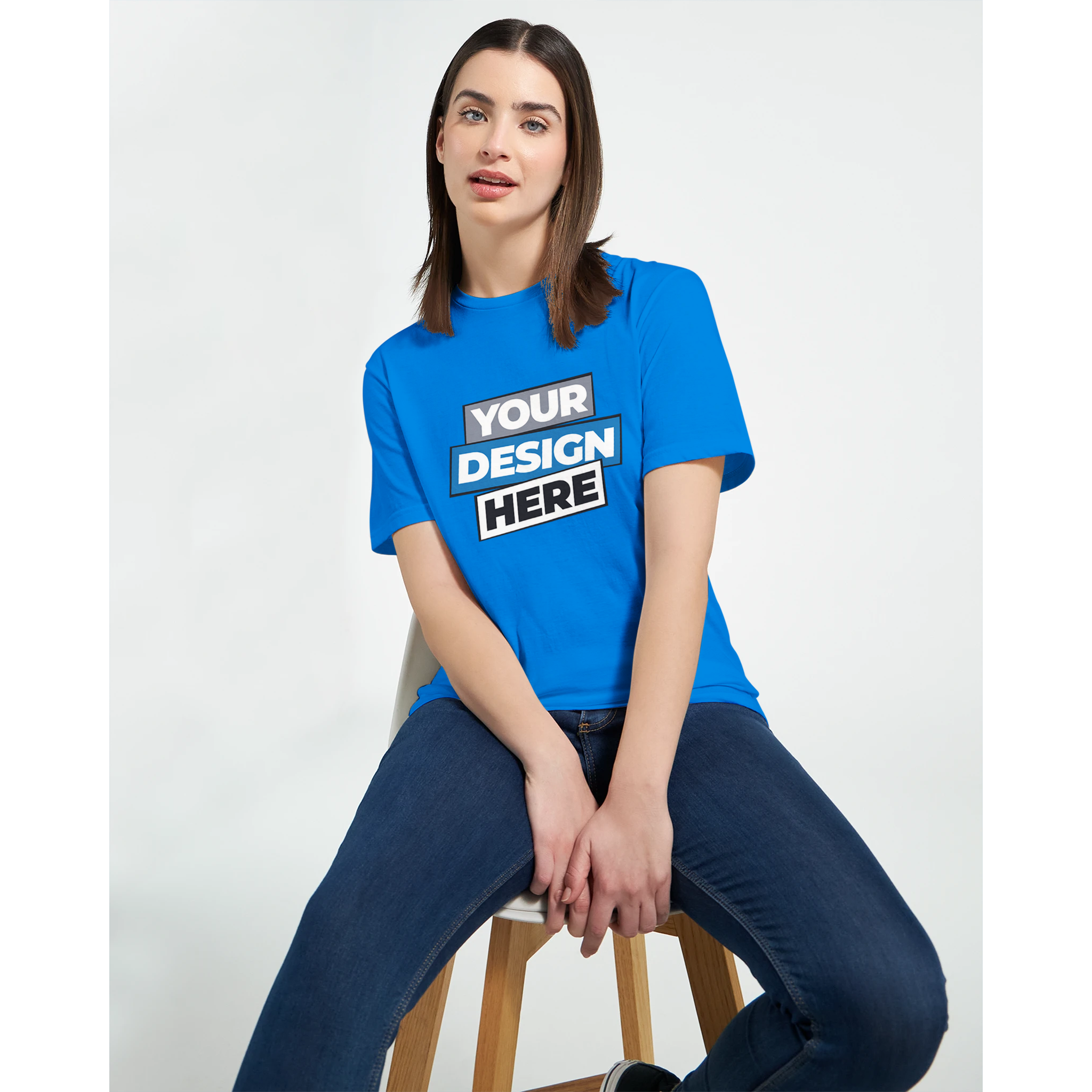 Woman wearing a blue Zalmera cotton t-shirt featuring a customizable print design, showcasing its semi-fitted stylish comfort.