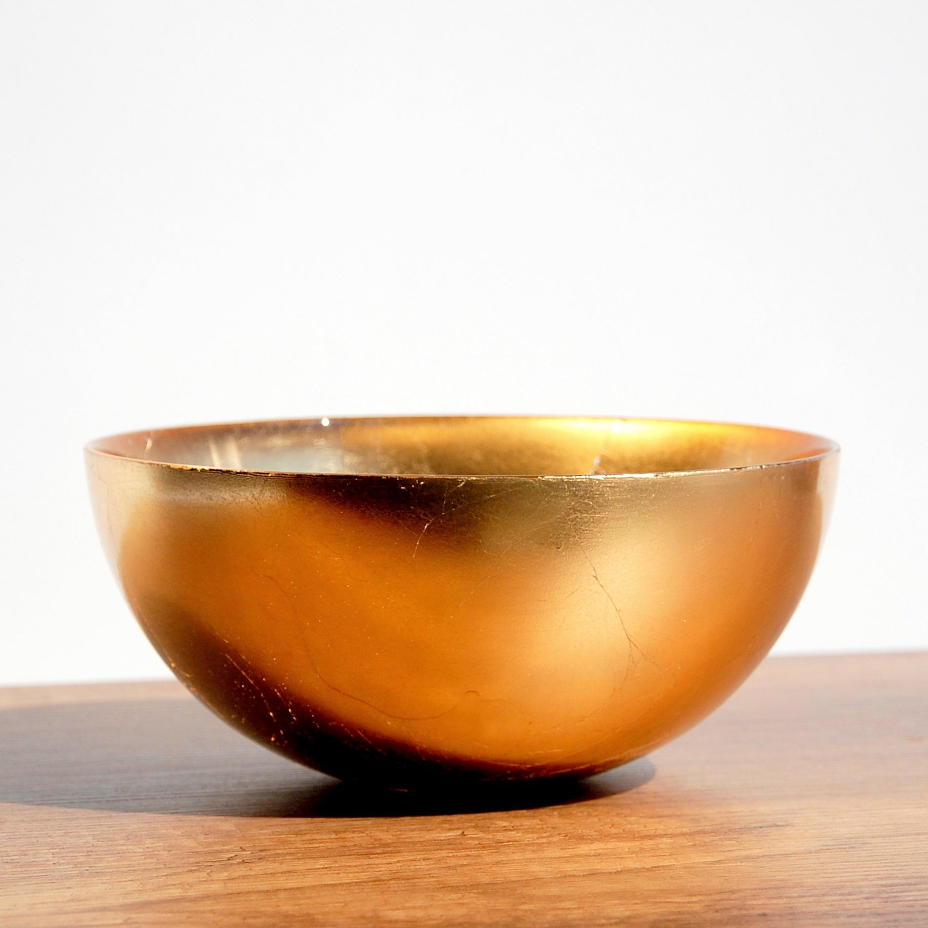 Aurion Gilded Glass Serving Bowl with gold metallic finish, ideal for salads or centerpieces, 8-inch size.