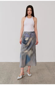 Model wearing Isvera slim cotton camisole with stylish long skirt and silver shoes, showcasing a modern, polished look.