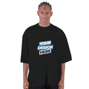 Model wearing Shaka Wear Men's Oversized Drop-Shoulder Crewneck T-Shirt in black with custom design.