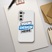 Custom print on demand gloss phone case for Samsung with dual-layer protection and precise cutouts, shown on a desk setup.