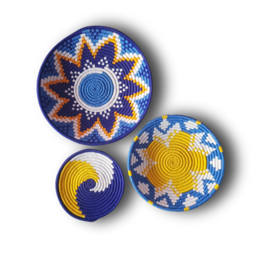 Handwoven boho wall art set with Ukrainian motifs in blue, yellow, and white, featuring sunburst and geometric designs.
