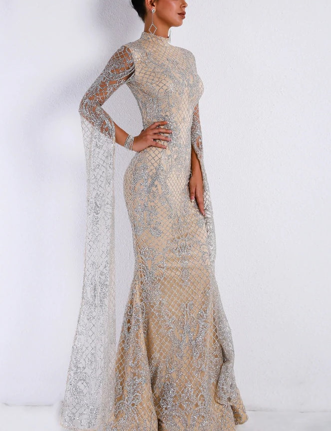Elegant woman wearing a high neck lattice gown with floor-length design, ideal for formal events.