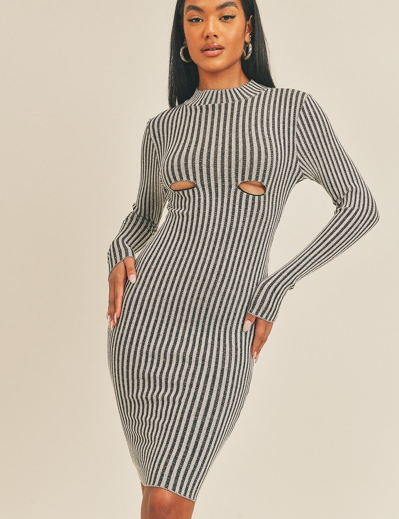 Woman wearing Sassy Curve Stripe Midi Dress with black-and-white stripes, mock neckline, long sleeves, and figure-hugging fit.