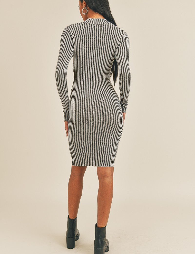 Back view of Sassy Curve Stripe Midi Dress with black-and-white stripes, mock neckline, and long sleeves, perfect for confident outings.