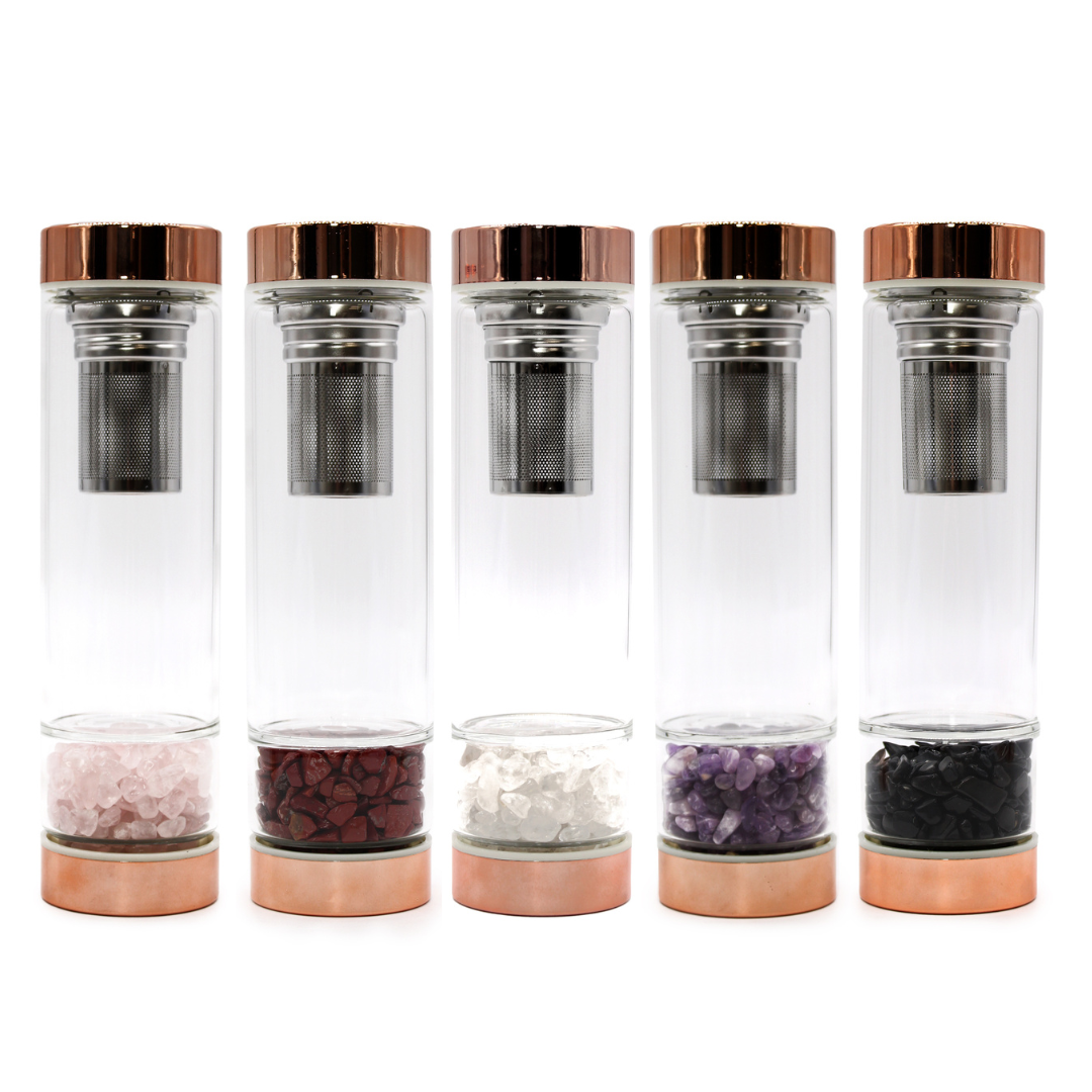 Collection of Elixir Glass Bottles with Gem Infusers and Rose Gold Lids, featuring various gemstone chambers for enhanced hydration.