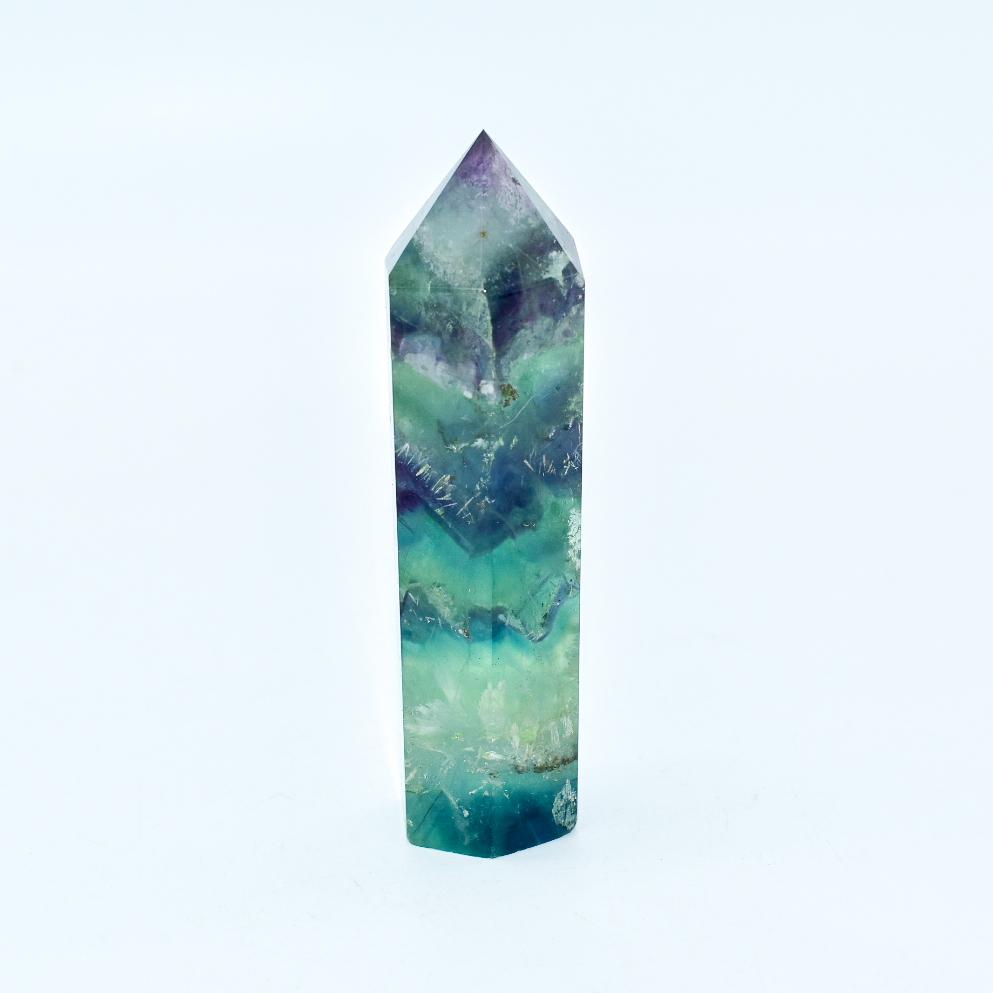 Polished Auren fluorite energy point crystal for spiritual alignment and meditation, promoting intuition and emotional grounding.