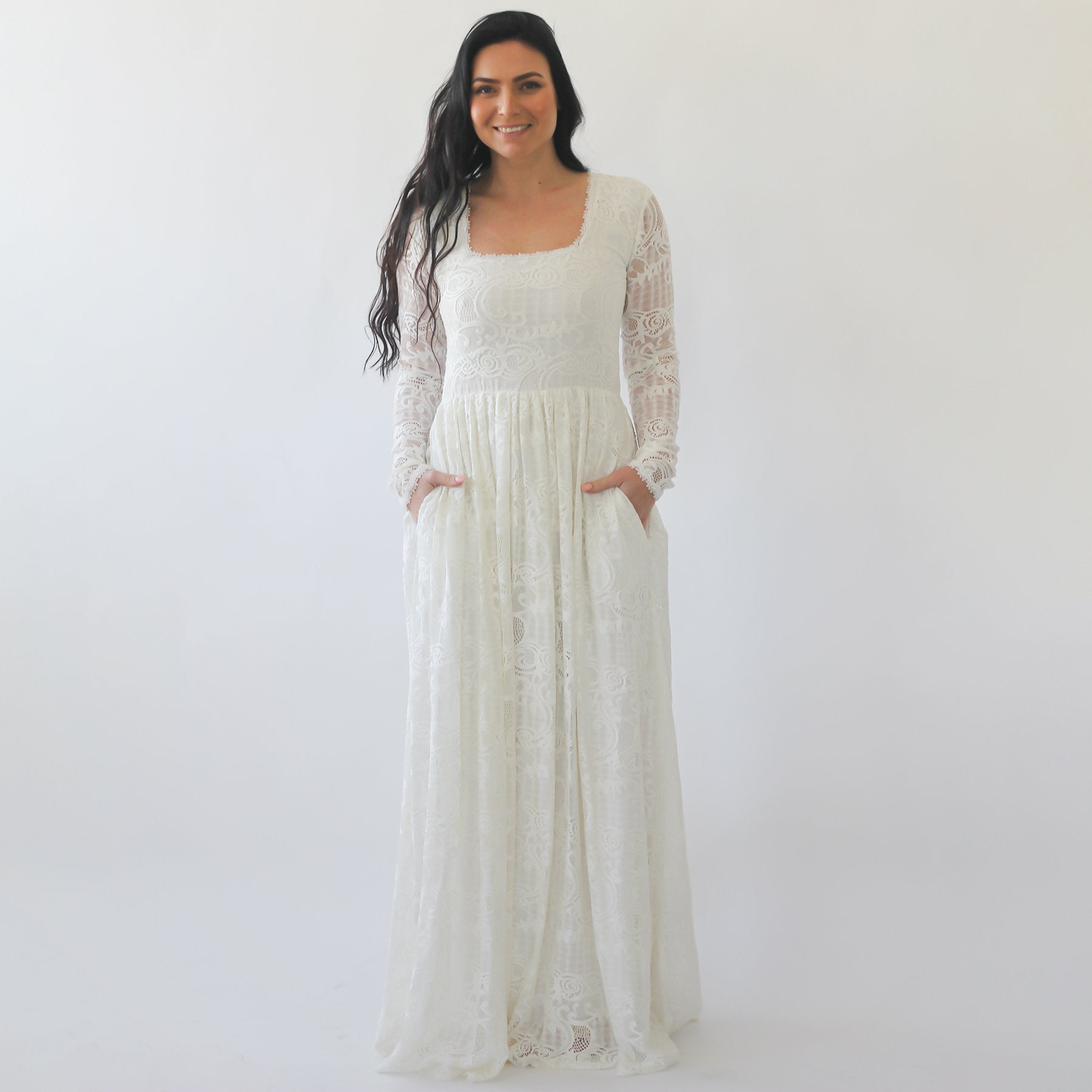Elowara Boho Wedding Dress with square neck, lace sleeves, and hidden pockets. Romantic ivory gown for modern brides seeking timeless elegance.