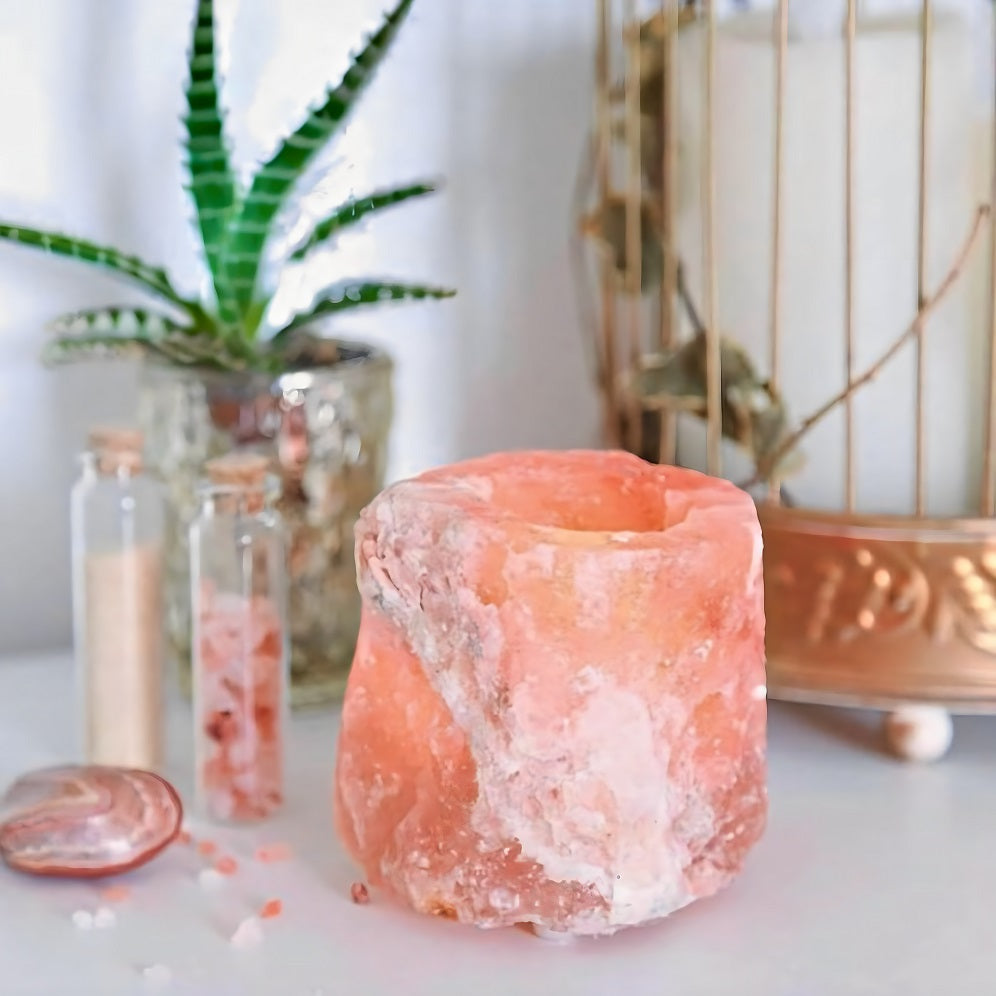 Handcrafted Himalayan salt candle holder with amber glow, enhancing meditation and relaxation with natural, grounding beauty.