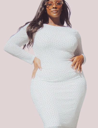 Woman wearing Isalyn Sparkle Midi Dress with rhinestone accents, sheer sleeves, and fitted skirt at an all-white event.