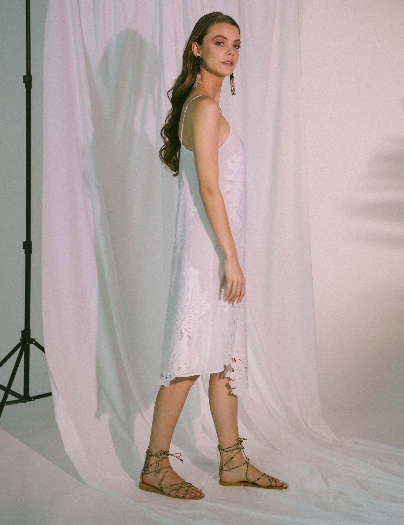 White Solea Crinkle Slip Dress with adjustable straps, offering a lightweight and breathable feel for effortless beauty and comfort.