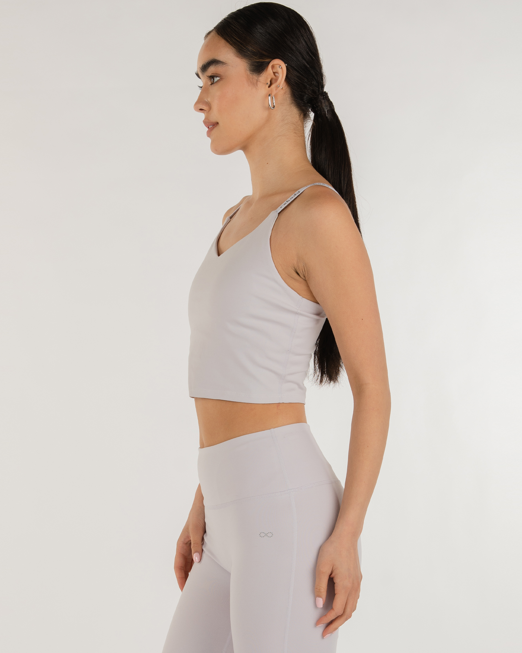 Model wearing Irynelle Contour Bra Top with scoop neckline and longline silhouette, ideal for yoga, city walks, and everyday elegance.