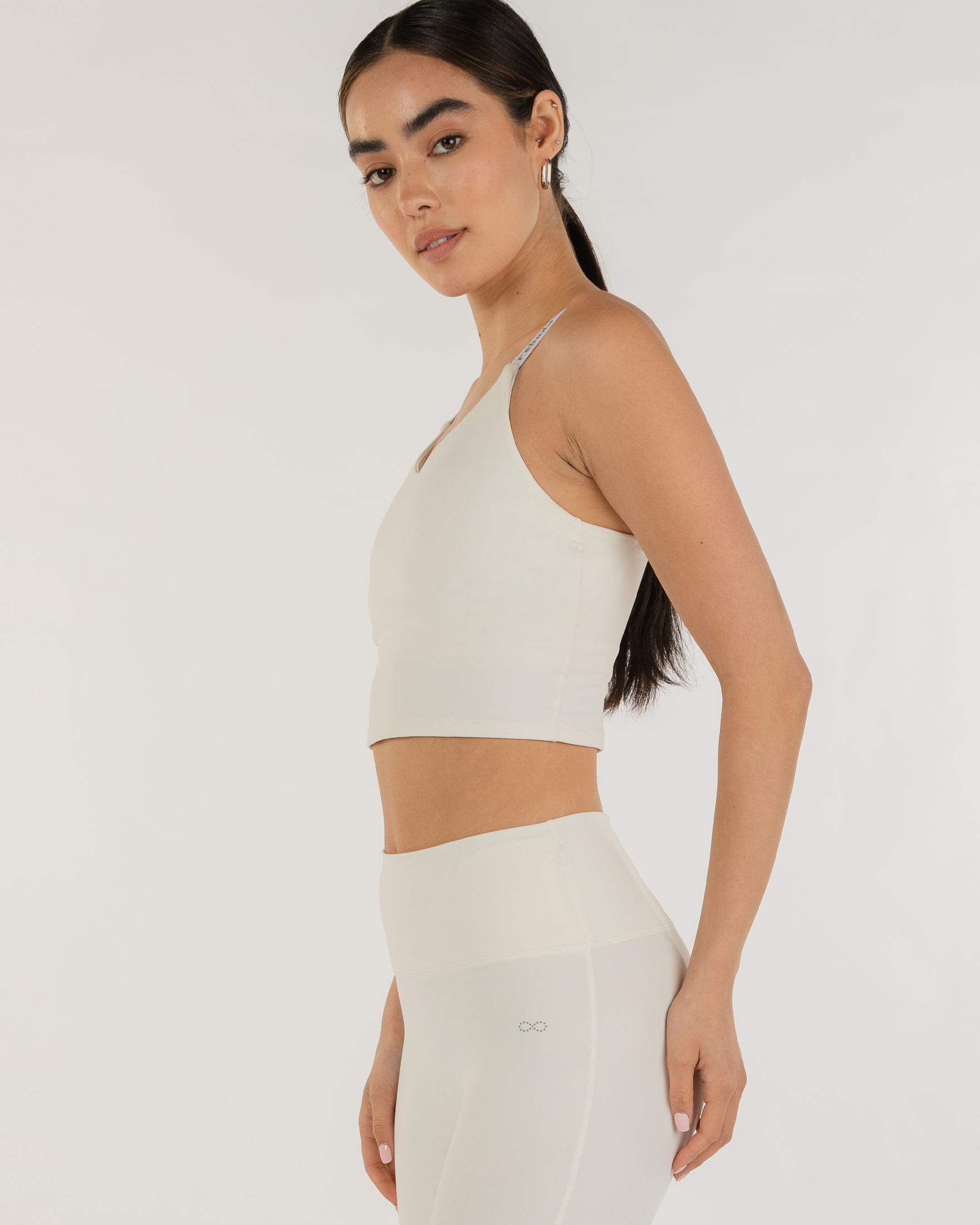 Model wearing Irynelle Contour Bra Top with longline silhouette, showcasing its scoop neckline and breathable stretch fabric.
