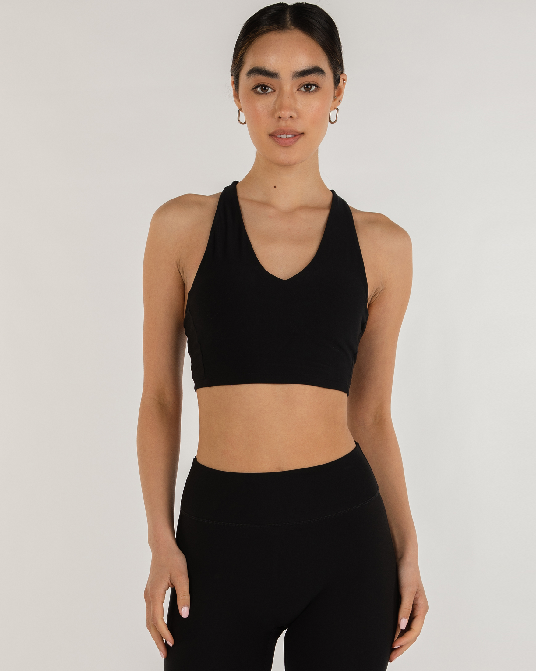 Avenysa Warm-Tech Bra showcasing longline silhouette and deep V neckline, designed for movement, warmth, and comfort in all seasons.