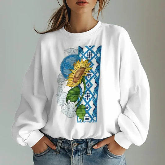 Ukrainian traditional t-shirt with sunflower print, blue geometric design, women's oversized sweatshirt, white long-sleeve, casual fashion.