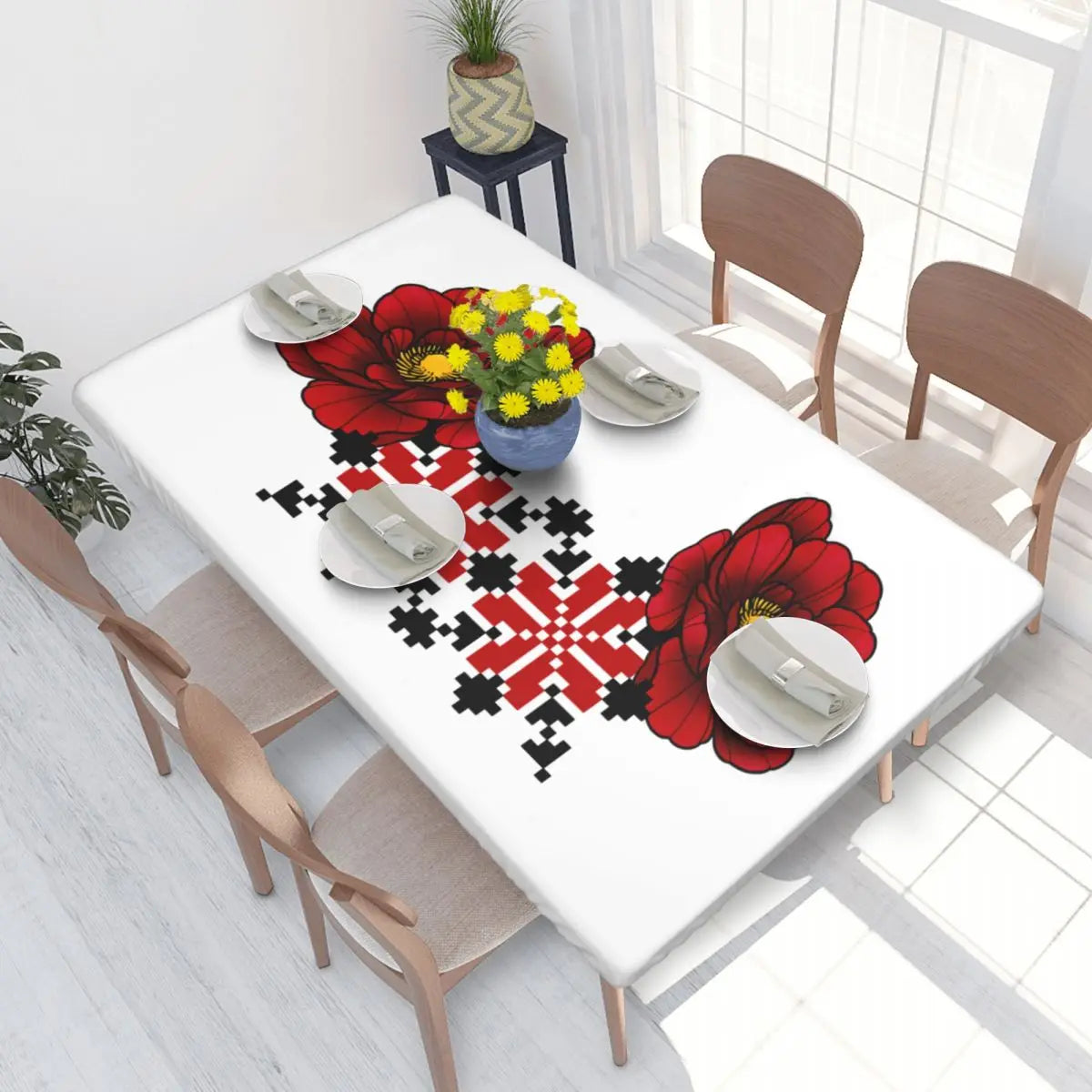 Authentic Ukrainian embroidery table cover with red floral patterns enhancing dining table decor.