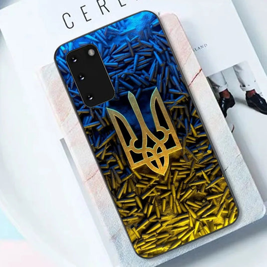 Ukrainian Tryzub design Samsung phone case with black TPU material on a book.