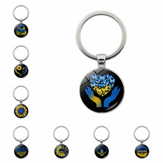 Ukrainian glass keychain with emblem designs, showcasing cultural pride and heritage in a stylish accessory.