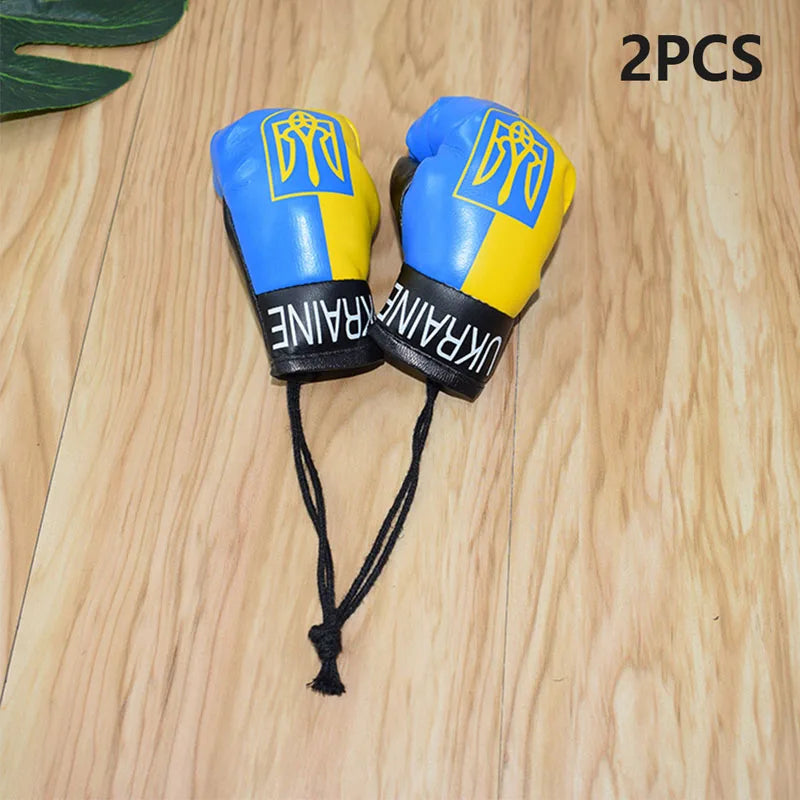 Ukraine flag boxing gloves keychains with blue and yellow design for patriotic pride.