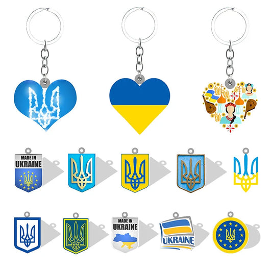 Collection of Ukrainian pendant keychains featuring heart and trident designs, promoting pride and unity with vibrant symbols.